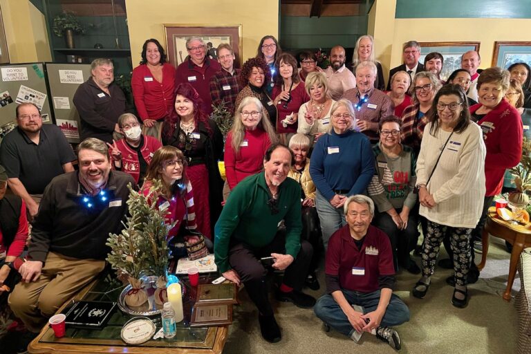 A large group of Indianapolis Ambassadors enjoying a Christmas party.